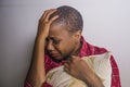 Lifestyle indoors portrait of young sad and depressed black african American woman sitting at home floor feeling desperate and wor Royalty Free Stock Photo