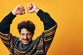 Man fashion happy portrait sweater orange trendy background Royalty Free Stock Photo