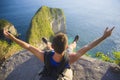 Lifestyle outdoors portrait of young happy and excited man with backpack trekking beach cliff looking at beautiful sea landscape Royalty Free Stock Photo