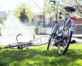 lifestyle people concept: couple of bicycle on green grass in summer park at fountain close up Royalty Free Stock Photo