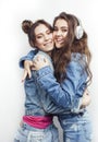 Lifestyle and people concept: Fashion portrait of two stylish girls best friends, over white background. Happy time Royalty Free Stock Photo