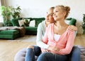 Lifestyle and people concept: Happy senior mother embracing adult daughter Royalty Free Stock Photo