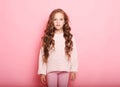 Lifestyle and people concept: litle girl kid with long curly hair Royalty Free Stock Photo