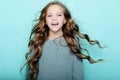 Lifestyle and people concept: litle girl kid with long curly hair Royalty Free Stock Photo