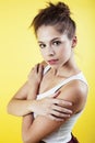 Lifestyle people concept: pretty young school teenage girl having fun happy smiling on yellow background Royalty Free Stock Photo