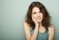 Lifestyle and people concept: Young casual woman portrait. Clean face, curly hair. Royalty Free Stock Photo