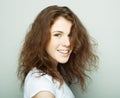 Lifestyle and people concept: Young casual woman portrait. Clean face, curly hair. Royalty Free Stock Photo