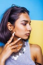 Lifestyle people concept. young pretty smiling indian girl with long nails wearing lot of jewelry rings, asian summer Royalty Free Stock Photo