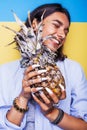 Lifestyle people concept. young pretty smiling indian girl with pineapple, asian summer fruits