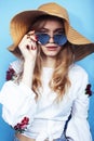 Lifestyle people at summer vacation concept. young pretty smiling blond girl with long hair wearing lot of jewelry rings Royalty Free Stock Photo