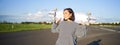 Lifestyle and people. Young asian girl posing with longboard, skating on her cruiser. Smiling woman holding skateboard Royalty Free Stock Photo