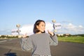 Lifestyle and people. Young asian girl posing with longboard, skating on her cruiser. Smiling woman holding skateboard Royalty Free Stock Photo