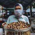 lifestyle photo malaysia street vendor sells nuts