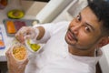 Lifestyle portrait of Asian home cook man or professional chief preparing for cooking and making Japanese sushi rolls wearing Royalty Free Stock Photo