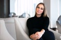 Lifestyle portrait of a beautiful business woman CEO, creative entrepreneur, startup owner, sitting in modern boardroom office wor