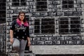 Lifestyle portrait of a beautiful young plus size woman