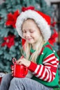 Cute little child girl eating sweet cookies and drinking hot cocoa Royalty Free Stock Photo