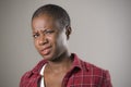 Lifestyle portrait if young unhappy and pretty afro American woman in contempt and disgust face expression as if disliking or find Royalty Free Stock Photo