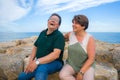 Lifestyle portrait of loving happy and sweet mature couple - senior retired husband and wife on 70s enjoying beach walk relaxed Royalty Free Stock Photo