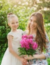 Lifestyle portrait mom and daughter are hugging in happiness in