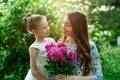 Lifestyle portrait mom and daughter are hugging in happiness in