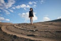 Lifestyle portrait of a woman brunettes Bouncing in the sand a clear day. Romantic, gentle, mystical, pensive image of a girl Royalty Free Stock Photo