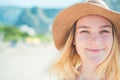 Lifestyle portrait. Woman enjoying looking view of beach ocean on hot summer day. Beach vacation. Banner with copy space. Royalty Free Stock Photo