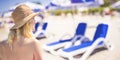 Lifestyle portrait. Woman enjoying looking view of beach ocean on hot summer day. Beach vacation. Banner with copy space. Royalty Free Stock Photo