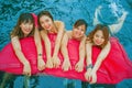 Young Asian Chinese and Korean women group of friends , attractive girlfriends at holidays resort swimming pool having fun in airb