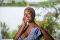 Lifestyle portrait of young attractive and joyful black african american woman smiling happy posing cheerful at home terrace with Royalty Free Stock Photo