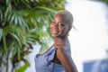 Lifestyle portrait of young attractive and joyful black african american woman smiling happy posing cheerful at home terrace with Royalty Free Stock Photo