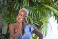 Lifestyle portrait of young attractive and joyful black african american woman smiling happy posing cheerful at home terrace with Royalty Free Stock Photo