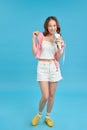 Lifestyle portrait of young cute and happy Asian student girl singing online karaoke song with microphone Royalty Free Stock Photo