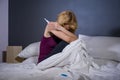 Lifestyle portrait of young desperate pregnant woman using pregnancy test sad and depressed for positive result expecting unwanted