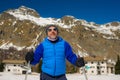 Lifestyle portrait of young happy and attractive man doing cross country ski enjoying winter holidays on Swiss Alps having fun on Royalty Free Stock Photo