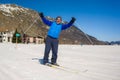 Lifestyle portrait of young happy and attractive man doing cross country ski enjoying winter holidays on Swiss Alps having fun on Royalty Free Stock Photo