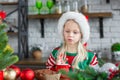 Cute little child girl eating sweet cookies and drinking hot cocoa Royalty Free Stock Photo