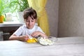 Lifestyle preschooler child girl cook food in the kitchen. development of fine motor skills in everyday life from scrap materials