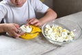 Lifestyle preschooler child girl cook food in the kitchen. development of fine motor skills in everyday life from scrap materials