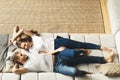 Lifestyle slow living consept at home with couple young men and woman lying on sofa, top view Royalty Free Stock Photo