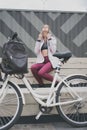 Lifestyle sport concepte. young woman with vintage bike in city parking. Nature color toning for design Royalty Free Stock Photo