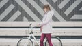 Lifestyle sport concepte. young woman with vintage bike in city parking. Nature color toning for design Royalty Free Stock Photo