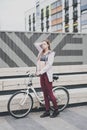 Lifestyle sport concepte. young woman with vintage bike in city parking. Nature color toning for design Royalty Free Stock Photo