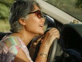 Lifestyle Summer portrait of middle aged happy and attractive classy Asian Indonesian woman driving car smiling cheerful and free Royalty Free Stock Photo