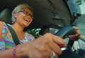 Lifestyle Summer portrait of middle aged happy and attractive classy Asian Indonesian woman driving left hand car smiling cheerful Royalty Free Stock Photo