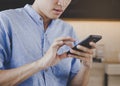 Lifestyle and technology. Man using mobile phone doing online banking Royalty Free Stock Photo