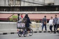 Lifestyle of thai people walking and biking tricycle at iron bridge cross over klong ong ang canal
