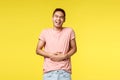 Lifestyle, travel and people concept. lmao so funny. Portrait of cheerful, enthusiastic asian man in pink t-shirt