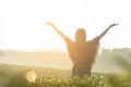 Lifestyle traveler women happy feeling good relax and freedom facing on the natural tea farm in the sunrise morning, Royalty Free Stock Photo