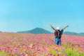 Lifestyle traveler women raise hand feeling good relax and happy freedom on the nature tea Royalty Free Stock Photo